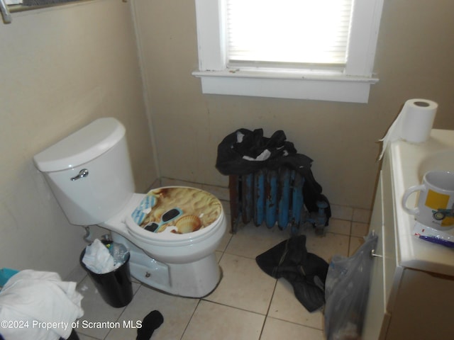 bathroom with tile patterned floors, vanity, and toilet