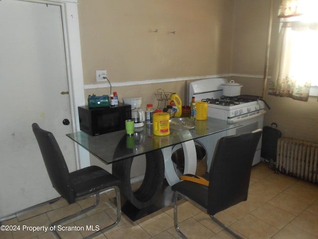 tiled dining area with radiator