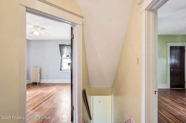 908 Prescott Ave, Scranton, PA 18510 - hallway with radiator heating unit, wood finished floors, and an upstairs landing