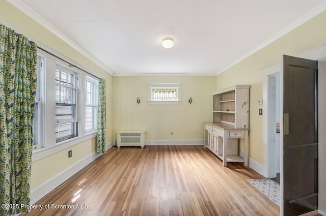 908 Prescott Ave, Scranton, PA 18510 - unfurnished dining area with radiator, light wood-style floors, and ornamental molding
