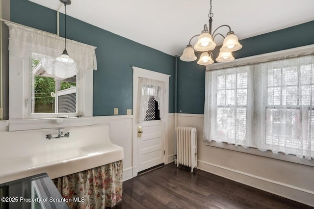 908 Prescott Ave, Scranton, PA 18510 - bathroom with radiator heating unit, healthy amount of natural light, a chandelier, wood finished floors, and wainscoting