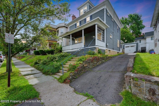 908 Prescott Ave, Scranton, PA 18510 - american foursquare style home with stairway, a porch, driveway, a detached garage, and a chimney