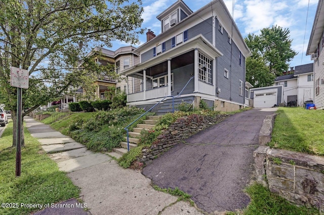 908 Prescott Ave, Scranton, PA 18510 - american foursquare style home with driveway, stairs, a chimney, a detached garage, and an outbuilding
