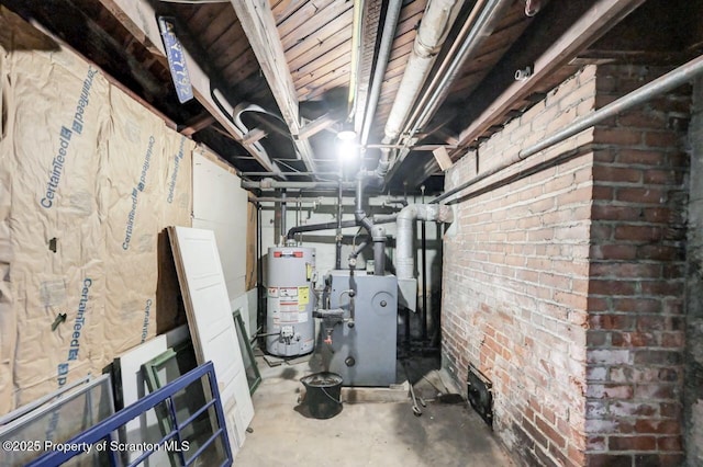 908 Prescott Ave, Scranton, PA 18510 - unfinished basement featuring water heater and brick wall
