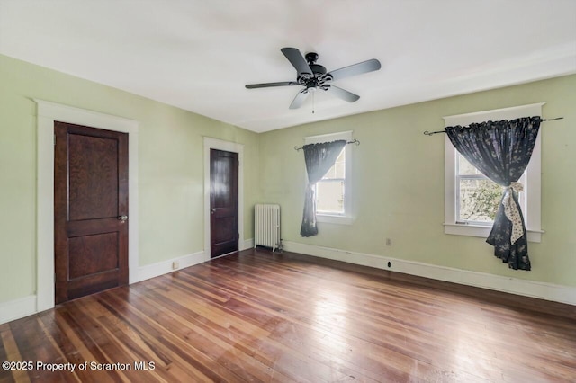 908 Prescott Ave, Scranton, PA 18510 - empty room with radiator heating unit, wood finished floors, and ceiling fan