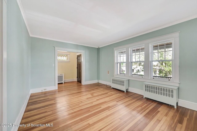 908 Prescott Ave, Scranton, PA 18510 - unfurnished room with radiator heating unit, light wood-type flooring, and ornamental molding