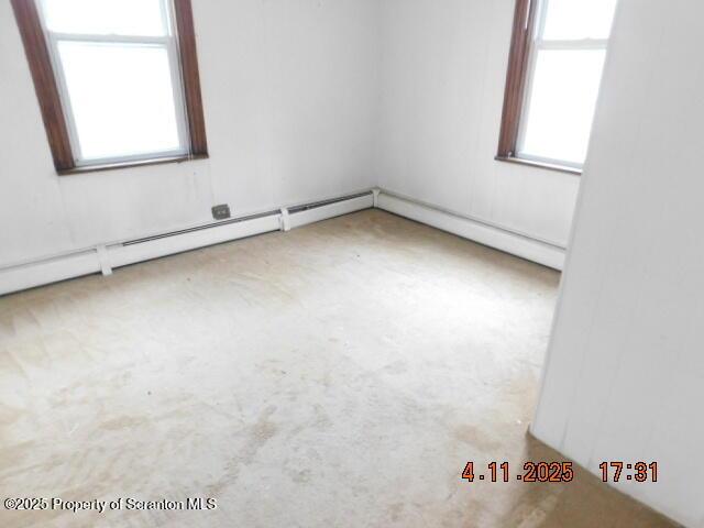 unfurnished room with carpet and a healthy amount of sunlight