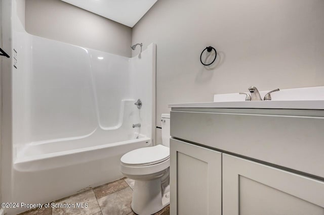 bathroom featuring toilet, shower / bathtub combination, and vanity