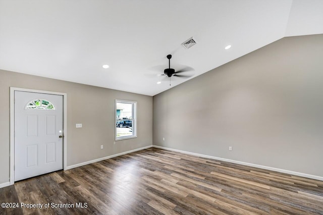 entrance foyer with visible vents, dark wood-type flooring, a ceiling fan, vaulted ceiling, and baseboards