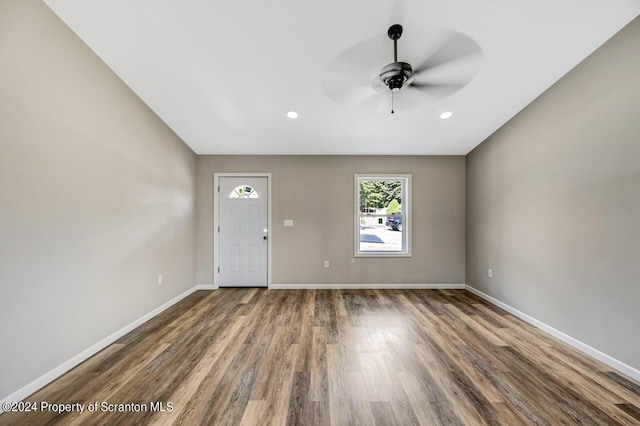 interior space featuring recessed lighting, dark wood finished floors, baseboards, and ceiling fan