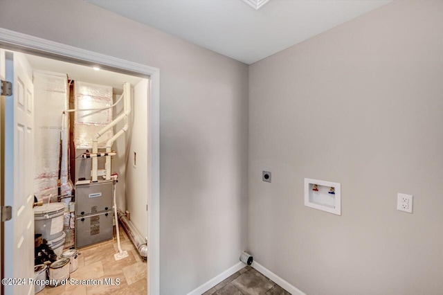 laundry area with baseboards, laundry area, washer hookup, and hookup for an electric dryer