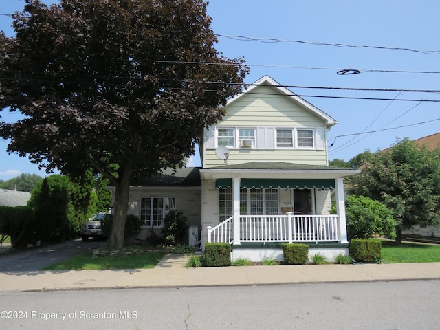 view of front of home featuring covered porch