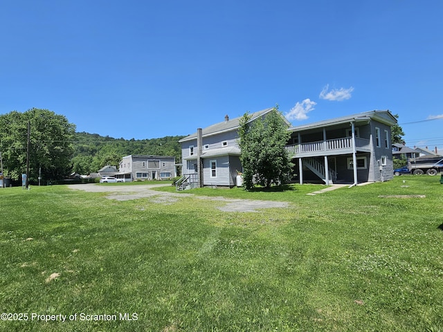 464 Main St, New Milford, PA 18834 - back of property with a yard and a deck