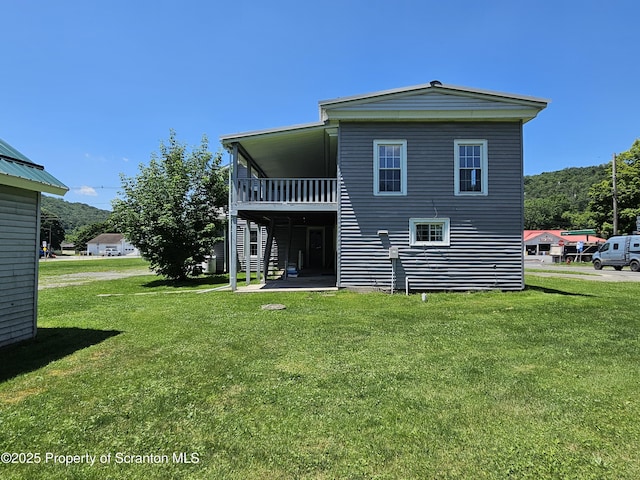 464 Main St, New Milford, PA 18834 - rear view of house with a yard