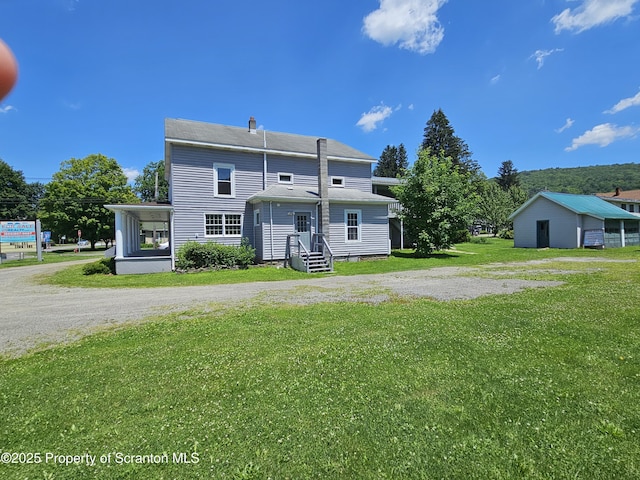 464 Main St, New Milford, PA 18834 - back of property with a lawn, a chimney, and driveway