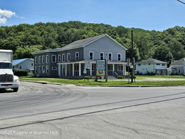464 Main St, New Milford, PA 18834 - townhome / multi-family property with a forest view