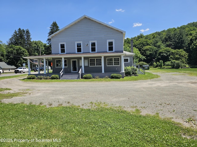 464 Main St, New Milford, PA 18834 - view of front of home featuring covered porch, a front yard, and dirt driveway