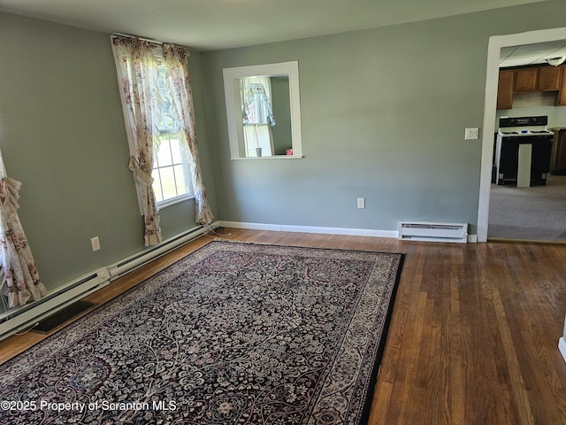464 Main St, New Milford, PA 18834 - unfurnished room with a baseboard radiator, a baseboard heating unit, and wood finished floors