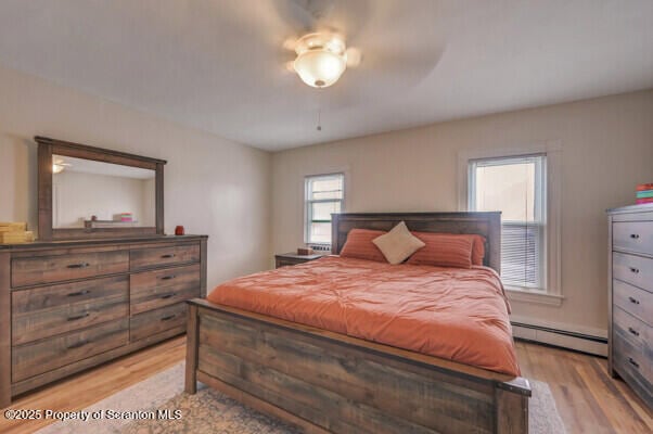 523 Hudson St, Forest City, PA 18421 - bedroom featuring baseboard heating and light wood-type flooring