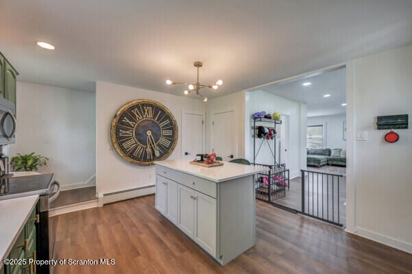 523 Hudson St, Forest City, PA 18421 - kitchen with baseboard heating, appliances with stainless steel finishes, a chandelier, dark wood-type flooring, and recessed lighting