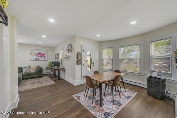 523 Hudson St, Forest City, PA 18421 - dining area featuring a baseboard heating unit, dark wood-style flooring, and recessed lighting
