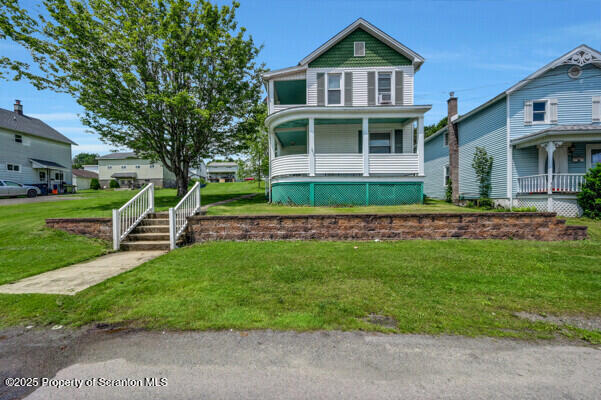 523 Hudson St, Forest City, PA 18421 - victorian home with a front yard and a porch