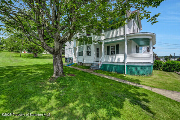523 Hudson St, Forest City, PA 18421 - view of front of home featuring a front yard and covered porch