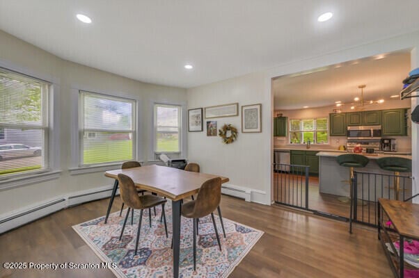 523 Hudson St, Forest City, PA 18421 - dining area featuring dark wood finished floors, a baseboard radiator, and recessed lighting