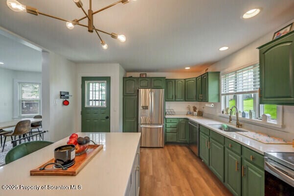523 Hudson St, Forest City, PA 18421 - kitchen featuring green cabinetry, stainless steel appliances, light countertops, healthy amount of natural light, and recessed lighting