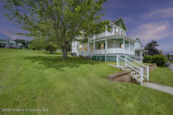 523 Hudson St, Forest City, PA 18421 - view of front of property with covered porch and a front yard