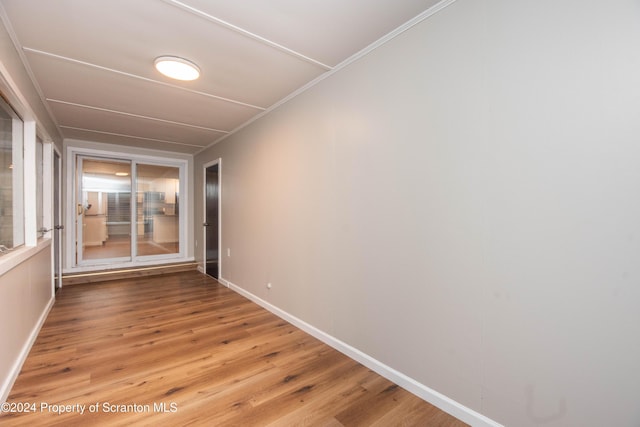 spare room with wood-type flooring