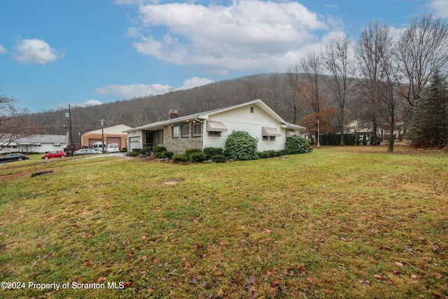 view of property exterior featuring a lawn