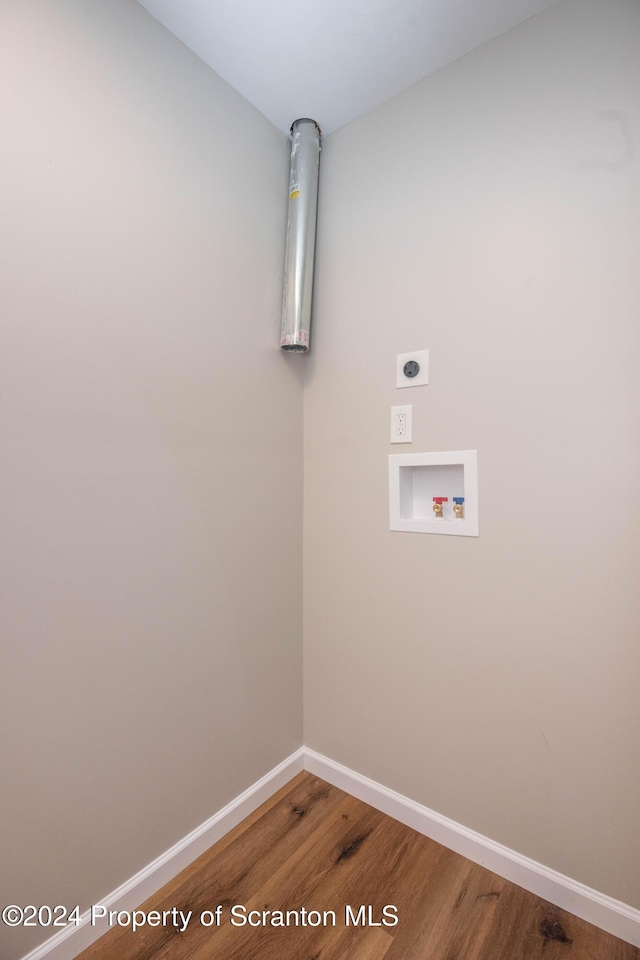 laundry area with hookup for a washing machine, electric dryer hookup, and wood-type flooring