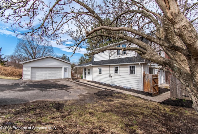 1332 Lackawanna Trl, Clarks Summit, PA 18411 - view of property exterior with an outdoor structure, a garage, and roof with shingles