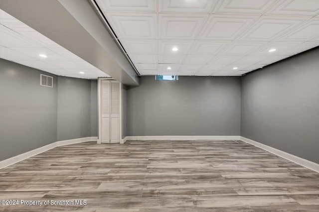 basement featuring light wood-type flooring