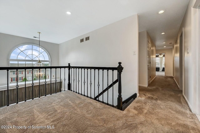 hallway with carpet