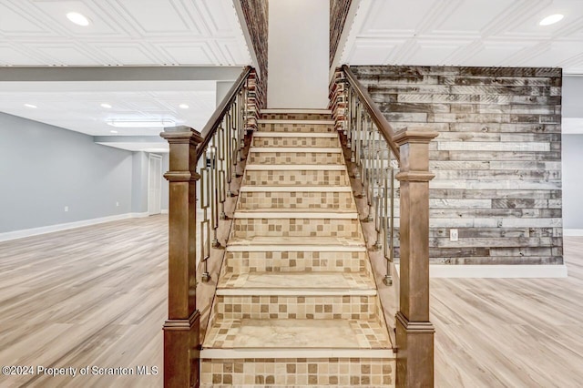 staircase featuring wood-type flooring