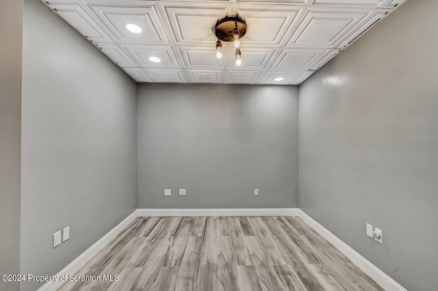 unfurnished room with light wood-type flooring