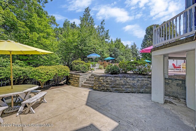 view of patio / terrace with a balcony