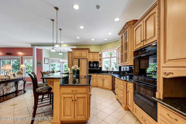 kitchen featuring a wealth of natural light, a center island, hanging light fixtures, tasteful backsplash, and black appliances