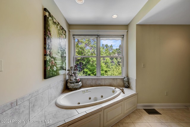 bathroom with tile patterned floors and a bathtub