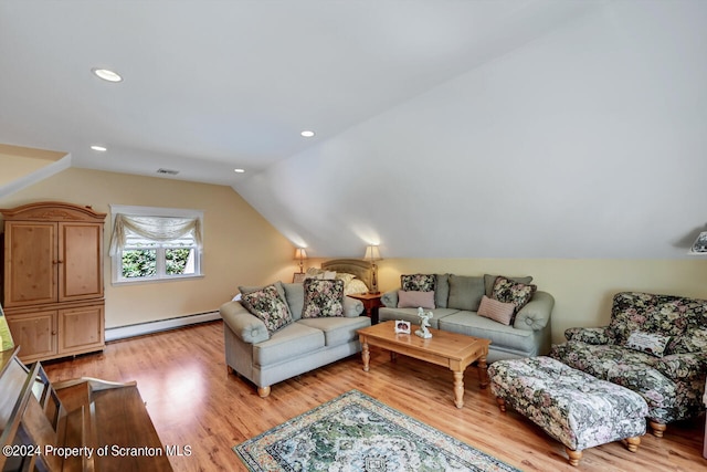 living room with light hardwood / wood-style flooring, vaulted ceiling, and baseboard heating