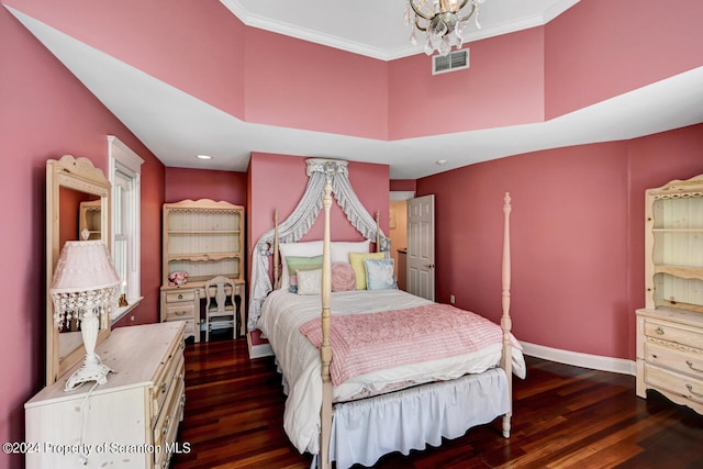 bedroom featuring dark hardwood / wood-style flooring, ornamental molding, and a notable chandelier