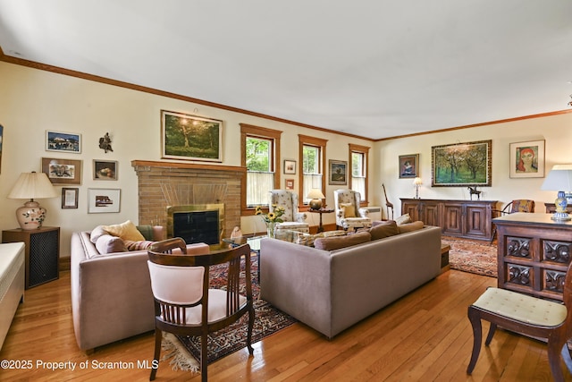 218 Weatherby St, Dalton, PA 18414 - living area with a fireplace, light wood-style flooring, and crown molding