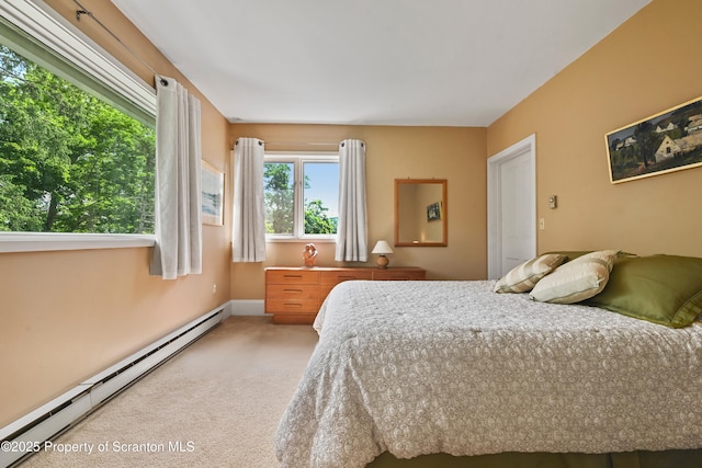 218 Weatherby St, Dalton, PA 18414 - bedroom featuring a baseboard heating unit, baseboards, and light colored carpet
