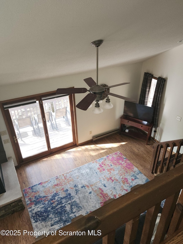 2258 Northgate Ct S Unit 16, Lake Ariel, PA 18436 - interior space with a ceiling fan, a textured ceiling, wood finished floors, and a healthy amount of sunlight