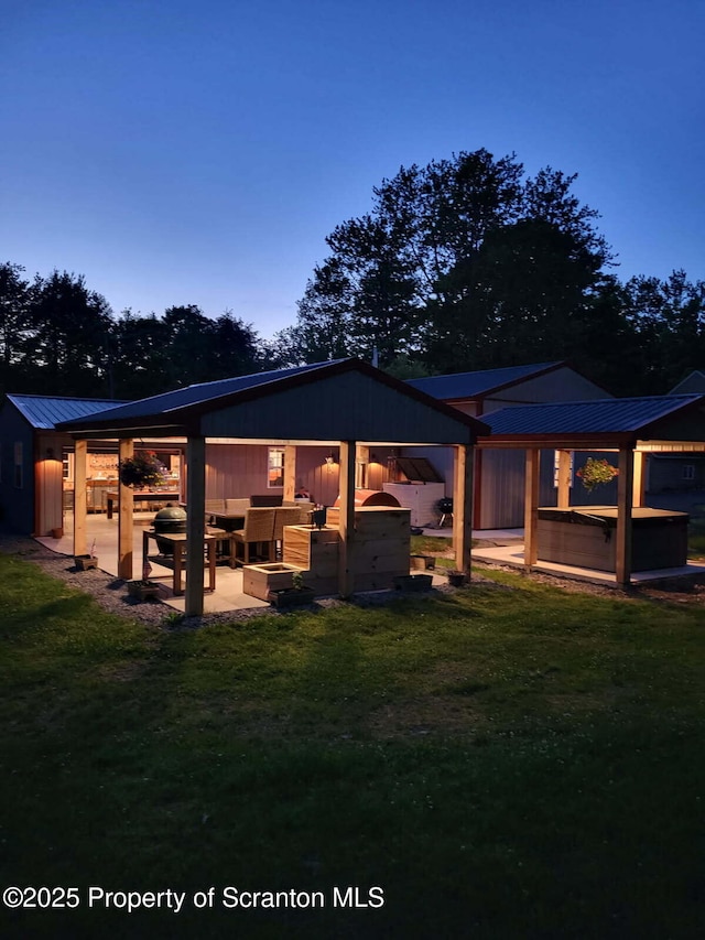 144 Crosstown Hwy, Union Dale, PA 18470 - rear view of house with a metal roof and a lawn