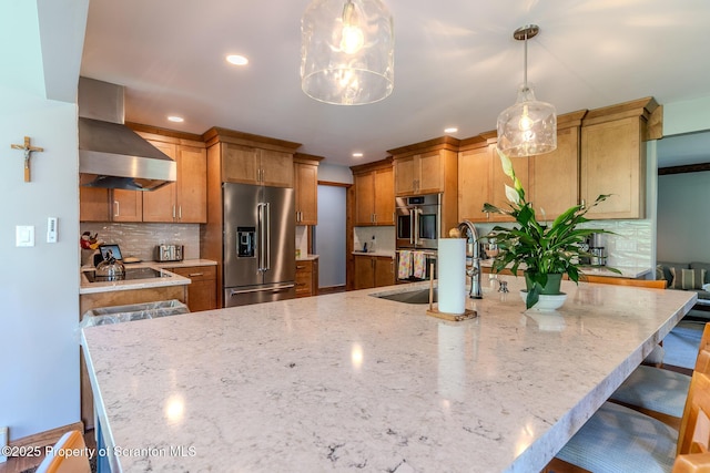 144 Crosstown Hwy, Union Dale, PA 18470 - kitchen with appliances with stainless steel finishes, wall chimney exhaust hood, recessed lighting, backsplash, and light stone countertops