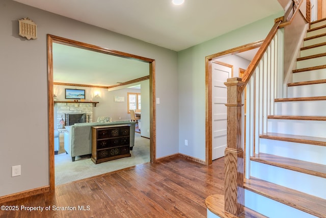 144 Crosstown Hwy, Union Dale, PA 18470 - entryway featuring hardwood / wood-style flooring, stairway, and a stone fireplace