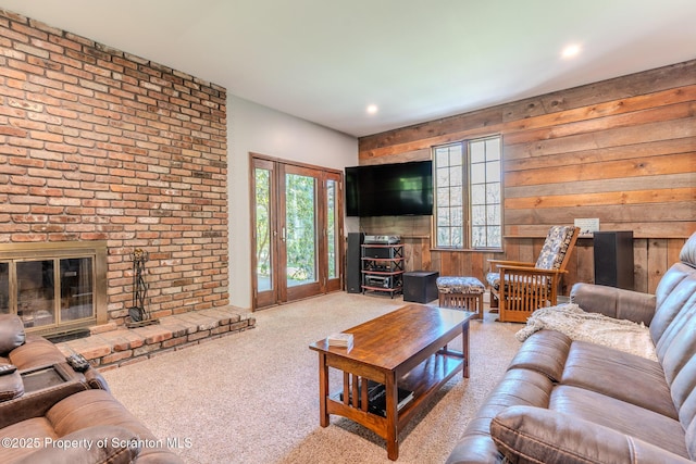 144 Crosstown Hwy, Union Dale, PA 18470 - carpeted living room with wood walls, a fireplace, and recessed lighting